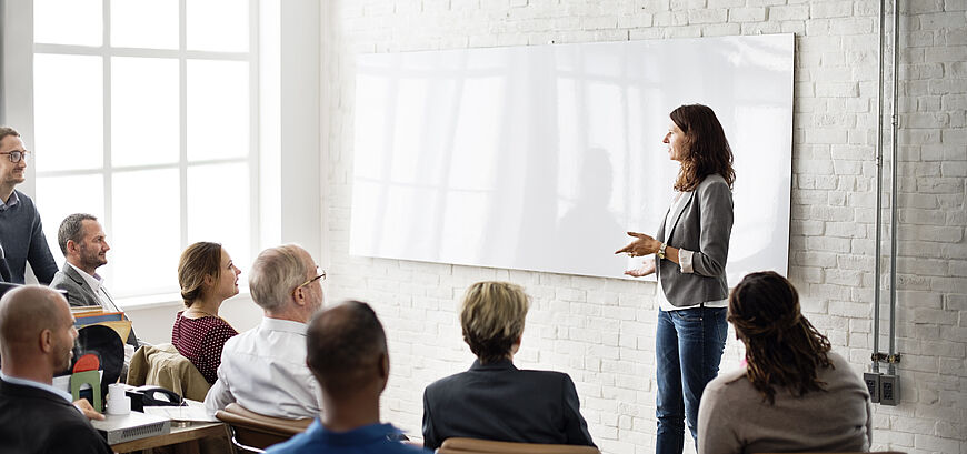 People standing in a bright room
